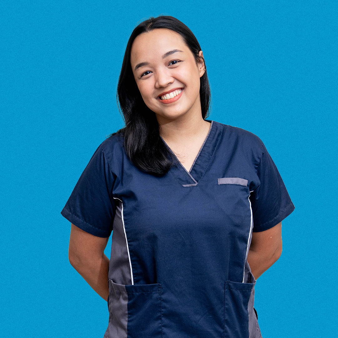 Portrait of a Halcyon Fitness physical therapist, arms behind her back and displaying a kind demeanor